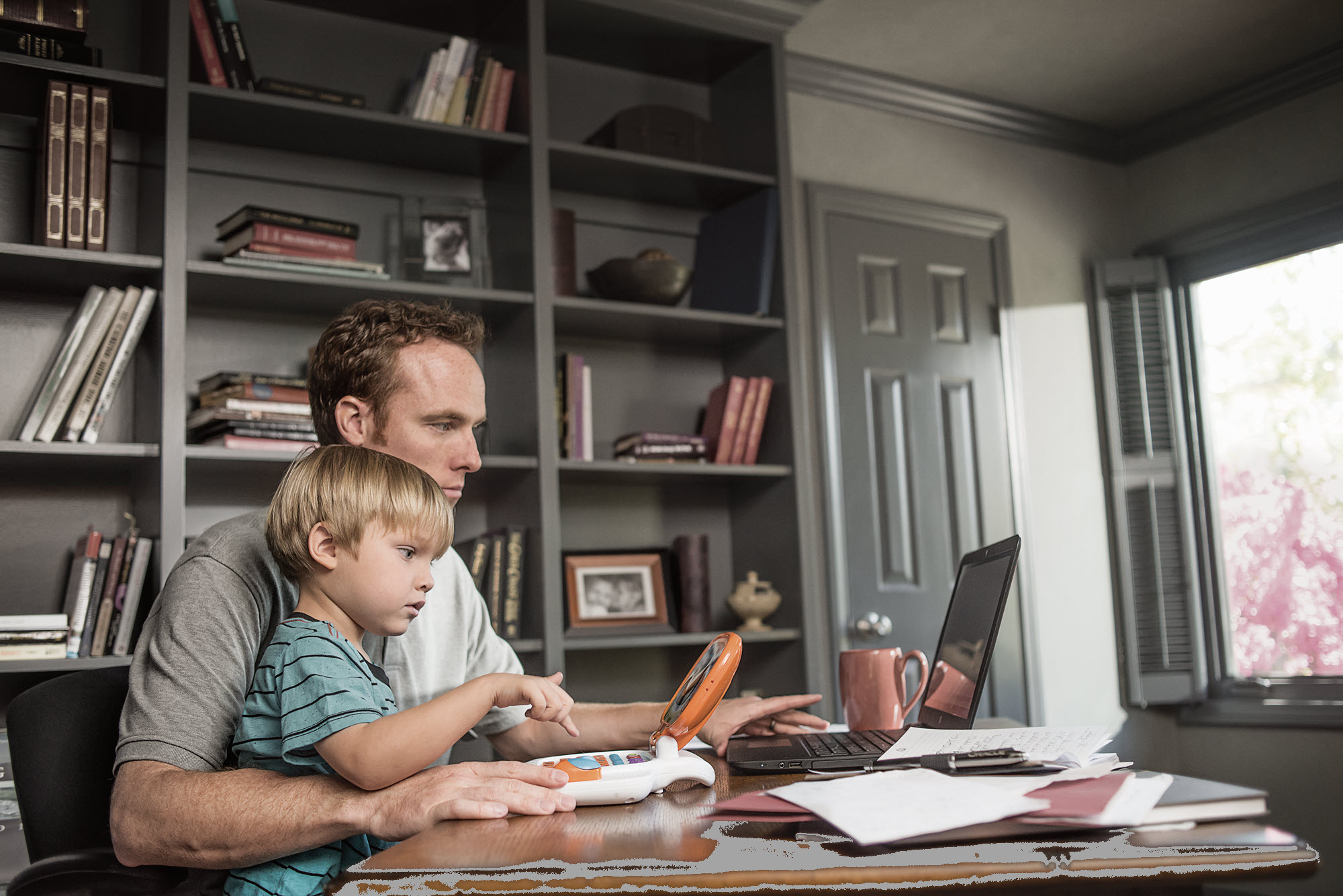 Image father and son at computer